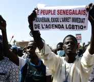 A protester in Dakar holds a sign reading 'No to LGBTQ+ agenda'.