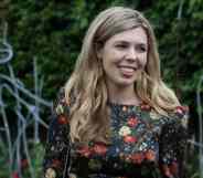 Carrie Johnson, the wife of prime minister Boris Johnson, wears a floral dress while standing outside