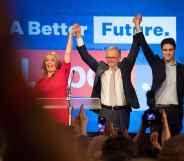 Anthony Albanese celebrates his election victory with his partner Jodie Haydon and son Nathan Albanese