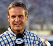 Tennessee governor Bill Lee speaks into a microphone during a sporting event