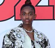 Zaya Wade stares at the camera while wearing a black and white floral patterned outfit