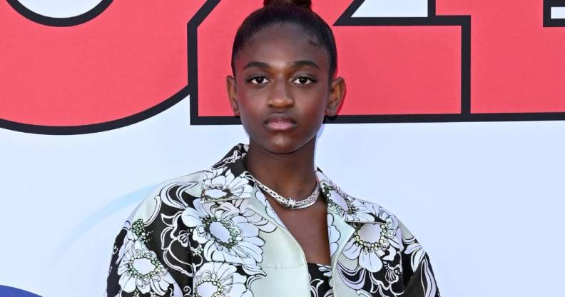 Zaya Wade stares at the camera while wearing a black and white floral patterned outfit