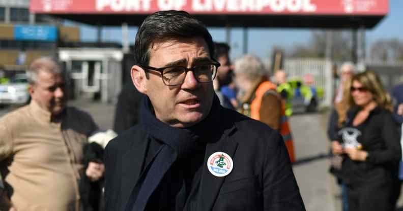 Mayor of Greater Manchester Andy Burnham wears a sticker in support of seafarers