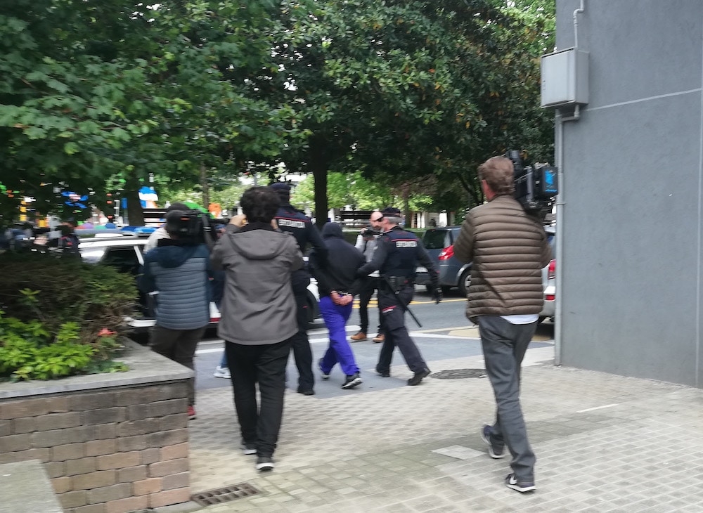 The suspected serial killer is escorted by Basque police officers after turning himself in