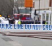 Police tape across a road