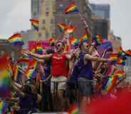 Revellers take part in a New York Pride parade