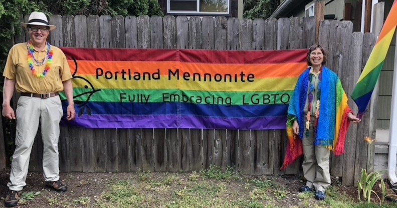 Members of the LGBTQ-inclusive Portland Mennonite Church with a Pride flag