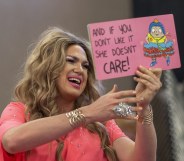 Drag queen Pickle reads from a book during a Drag Queen Story Hour event at the West Valley Regional Branch Library in Los Angeles, California