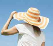 Woman wearing a sun hat looking away from the camera