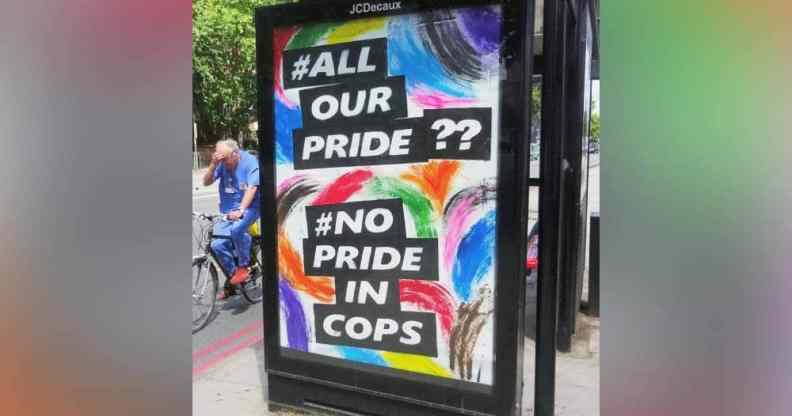 A colourful sign reading 'All Our Pride?? No Pride in Cops' is displayed outside a bus stop in London