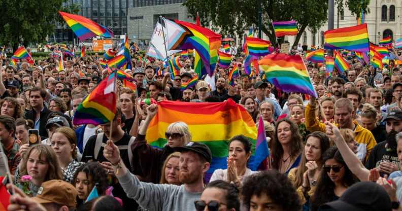 Crowds cheer as speeches are held in front of the Oslo City Hall