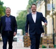 Labour leader Keir Starmer (L) and Simon Lightwood walking down a street