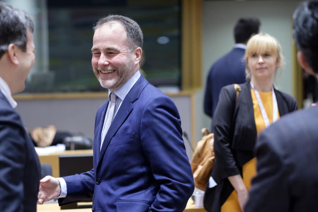 Italian Minister of European Affairs Vincenzo (Enzo) Amendola (L) is talking with then British Minister of State for Europe and the Americas Christopher John Pincher