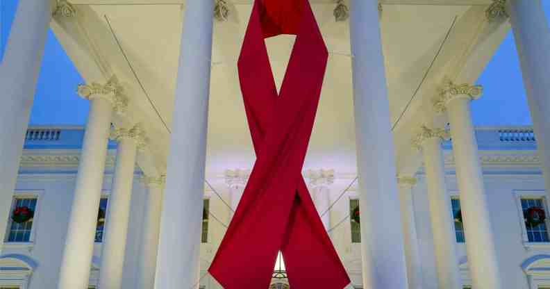 A large red ribbon is seen on the White House