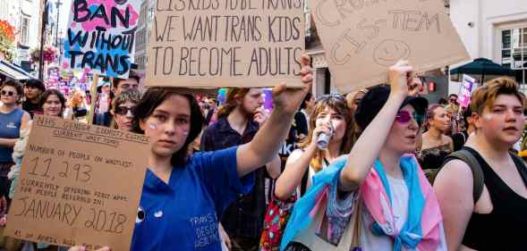 Thousands of people pass through Soho on a London Trans+ Pride march