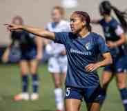 Jaelene Daniels of North Carolina Courage instructs team during a game