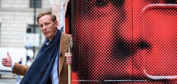 Laurence Fox leans out from the rear of his battle bus a