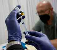 A healthcare worker prepares to administer a monkeypox vaccine in Florida