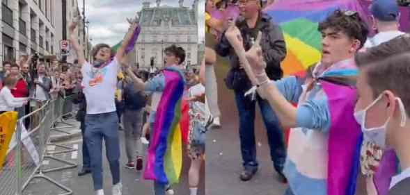 Joe Locke and Sebastian Croft, who are stars of the hit series Heartstopper, wear Pride flags as they dance around and wave the middle finger at a crowd of anti-LGBTQ+ protestors at Pride in London