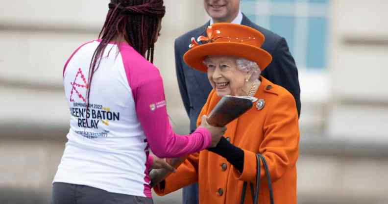 Queen Elizabeth II presents the Commonwealth Games baton to British Paralympic athlete Kadeena Cox.