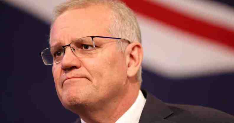 Scott Morrison stood in front of an Australian flag