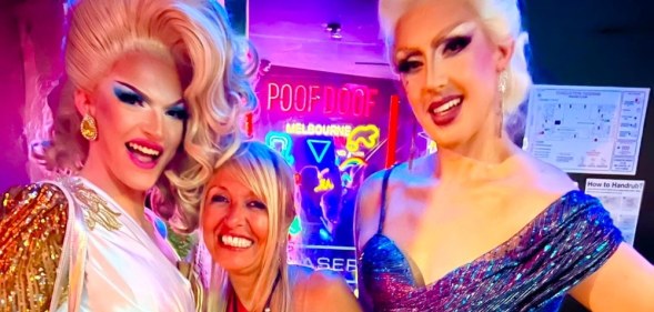 In this photograph, Martha Tsamis poses with two drag queens either side of her