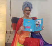 Cherrie Ontop reading a story book at story time event