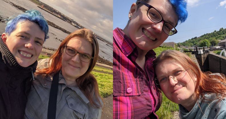 In the photograph on the left, a person with blue hair wears a dark jacket as they embrace their partner with red hair and a grey jacket. The couple is posed in front of a body of water. In the image on the right, the same couple are posed outdoors. The person with the blue hair is now wearing a red and purple plaid shirt while their partner is wearing a lighter top
