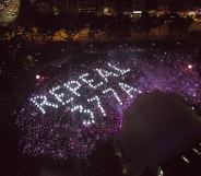 Attendees form the words 'Repeal 377A' in lights at Singapore's Pink Dot event, 2019