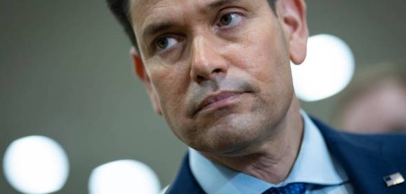 Marco Rubio wears a blue shirt, blue tie and matching blue suit jacket