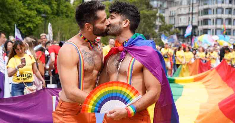 Two men share a kiss at London Pride