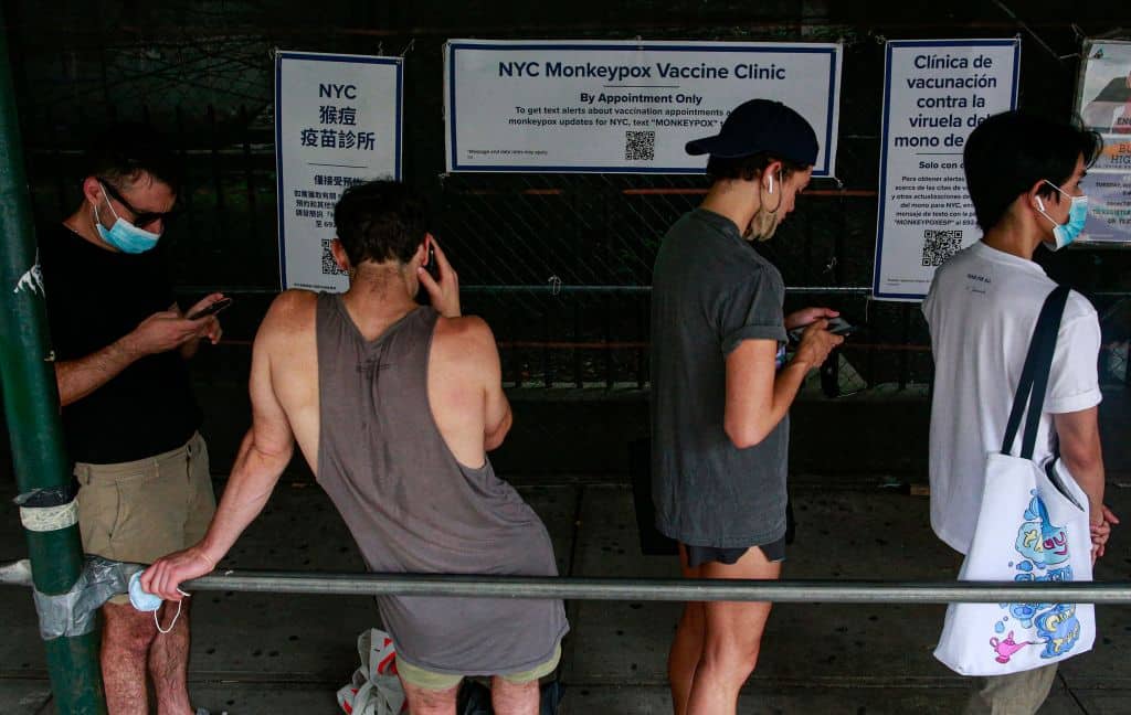 People wait in line to recieve the Monkeypox vaccine before the opening of a new mass vaccination site at the Bushwick Education Campus in Brooklyn. 