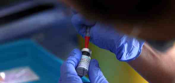 A medical professional prepares a dose of the monkeypox vaccine on July 23, 2022 in London, England.