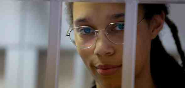 Brittney Griner looks out of a jail cell