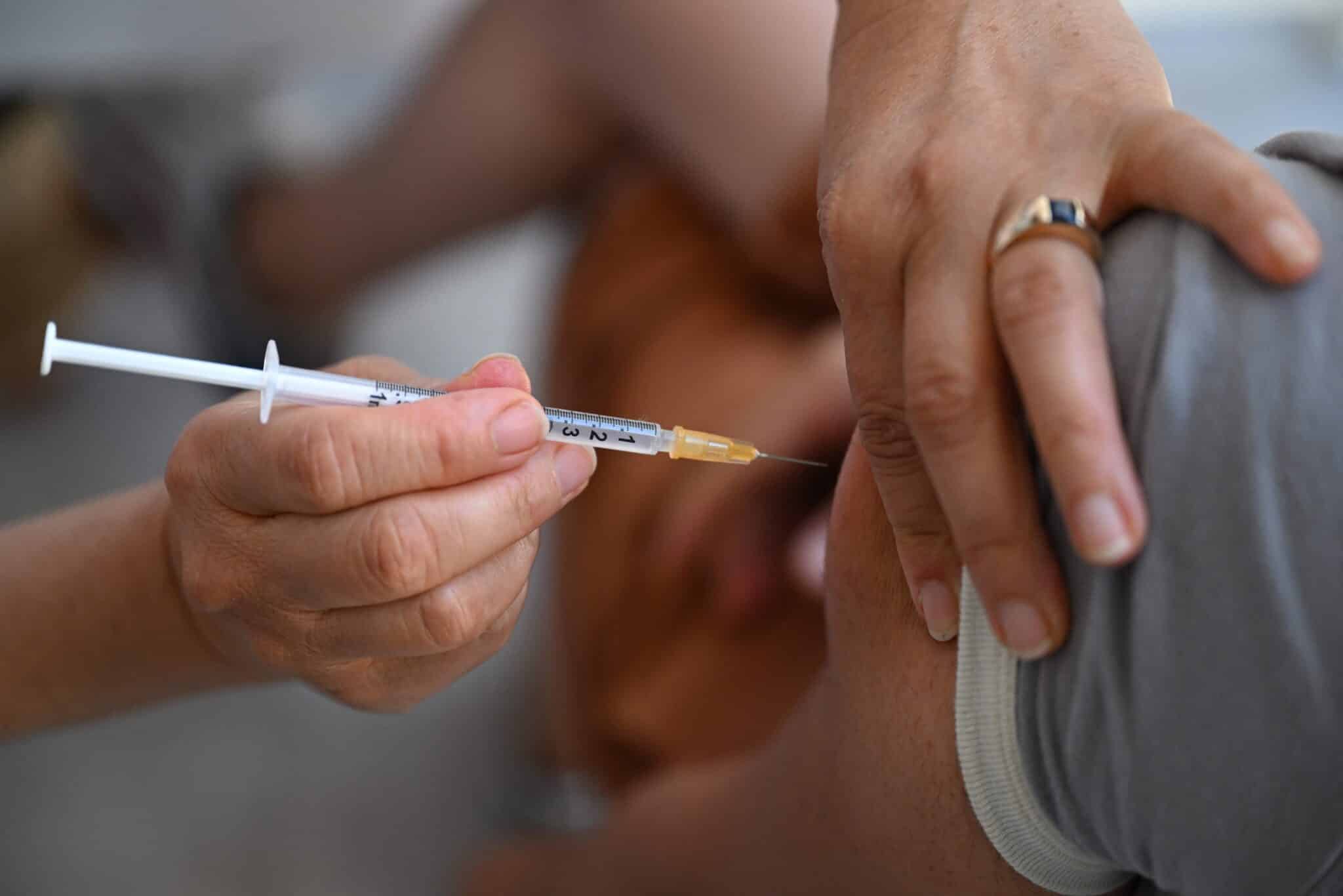 A person receiving a vaccine.