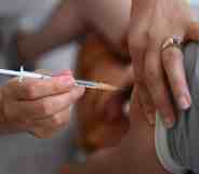 A person receiving a vaccine.