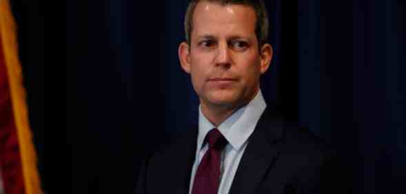 In this photograph, Andrew Warren holds a press conference