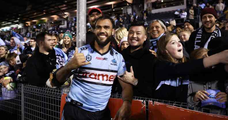 Toby Rudolf of the Sharks celebrates with fans after the round 20 NRL match between the Cronulla Sharks and the South Sydney Rabbitohs