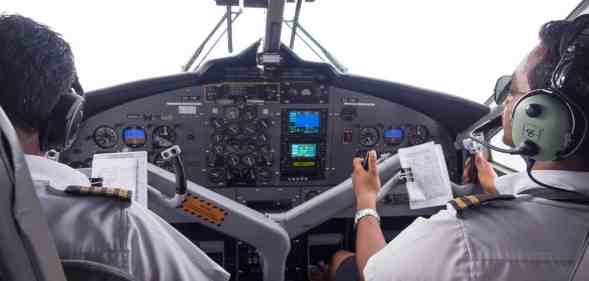 Pilots operating a commercial plane.