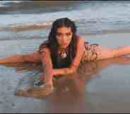 Lourdes Leon as Lolahol on a beach in her new music video