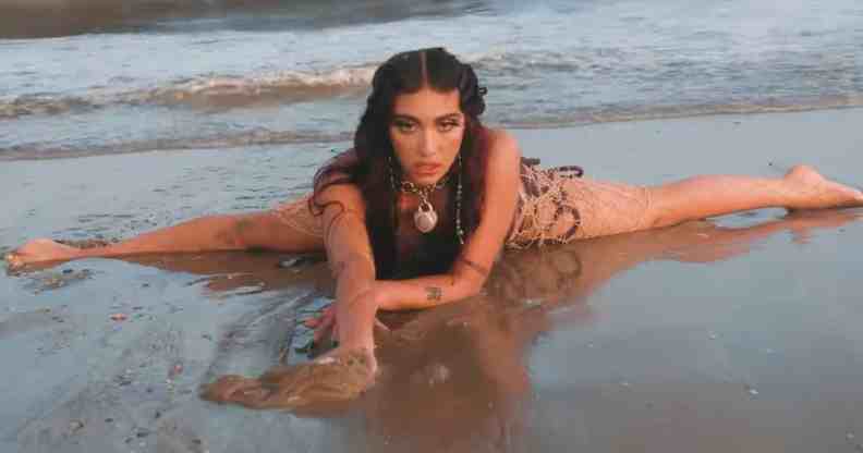 Lourdes Leon as Lolahol on a beach in her new music video