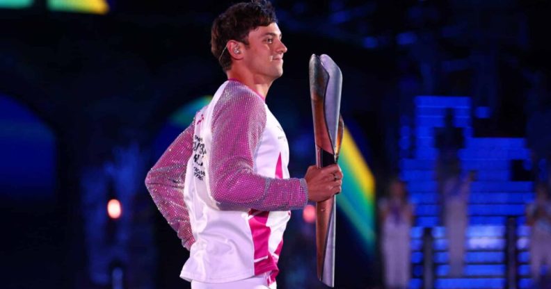 Tom Daley carries the Queen’s Baton during the Opening Ceremony of Commonwealth Games.