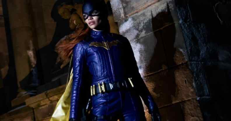 Leslie Grace poses in the purple Batgirl costume