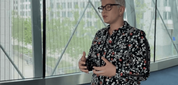 Maria Walsh speaking in the corridor of an office