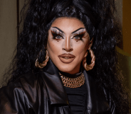 Drag Race Uk star Cherry Valentine wears a dark outfit