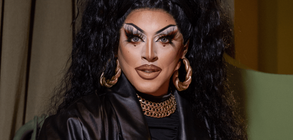 Drag Race Uk star Cherry Valentine wears a dark outfit