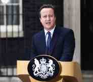 Prime minister David Cameron stands at a podium