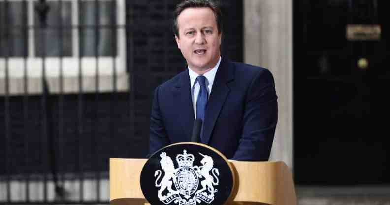 Prime minister David Cameron stands at a podium