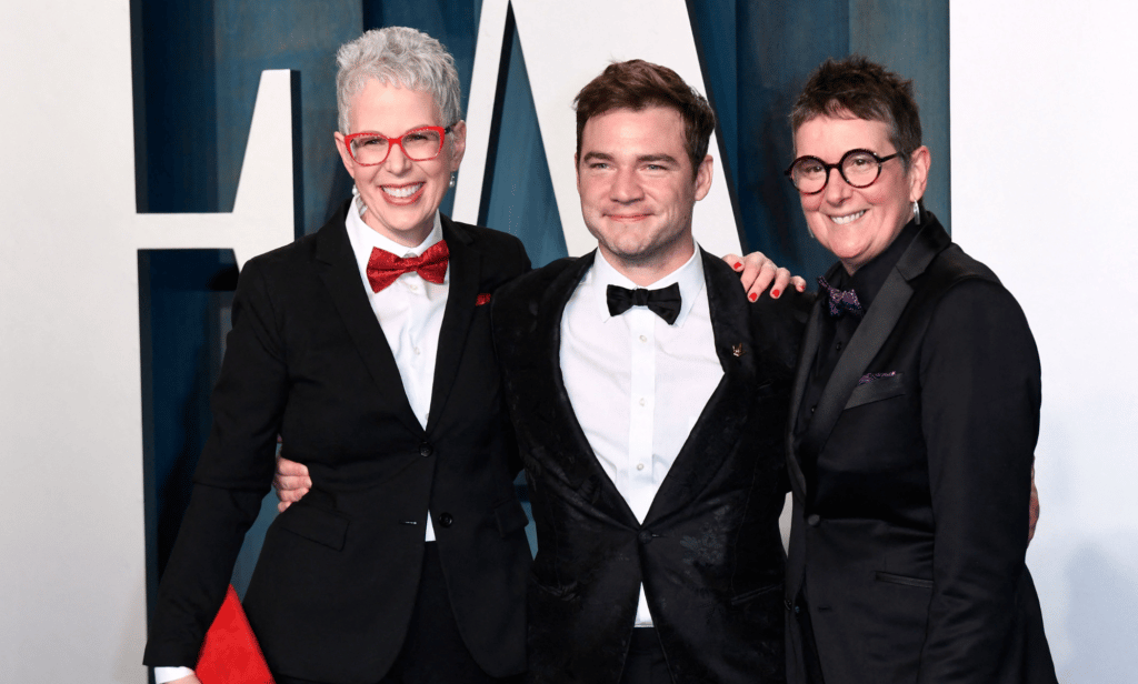 Actor Daniel Durant poses with both of his moms on either side of him