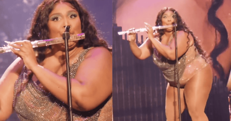 Lizzo wears a sparkly outfit as she plays a crystal flute during a live concert